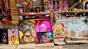Colorful shops selling prasad, flowers, and souvenirs